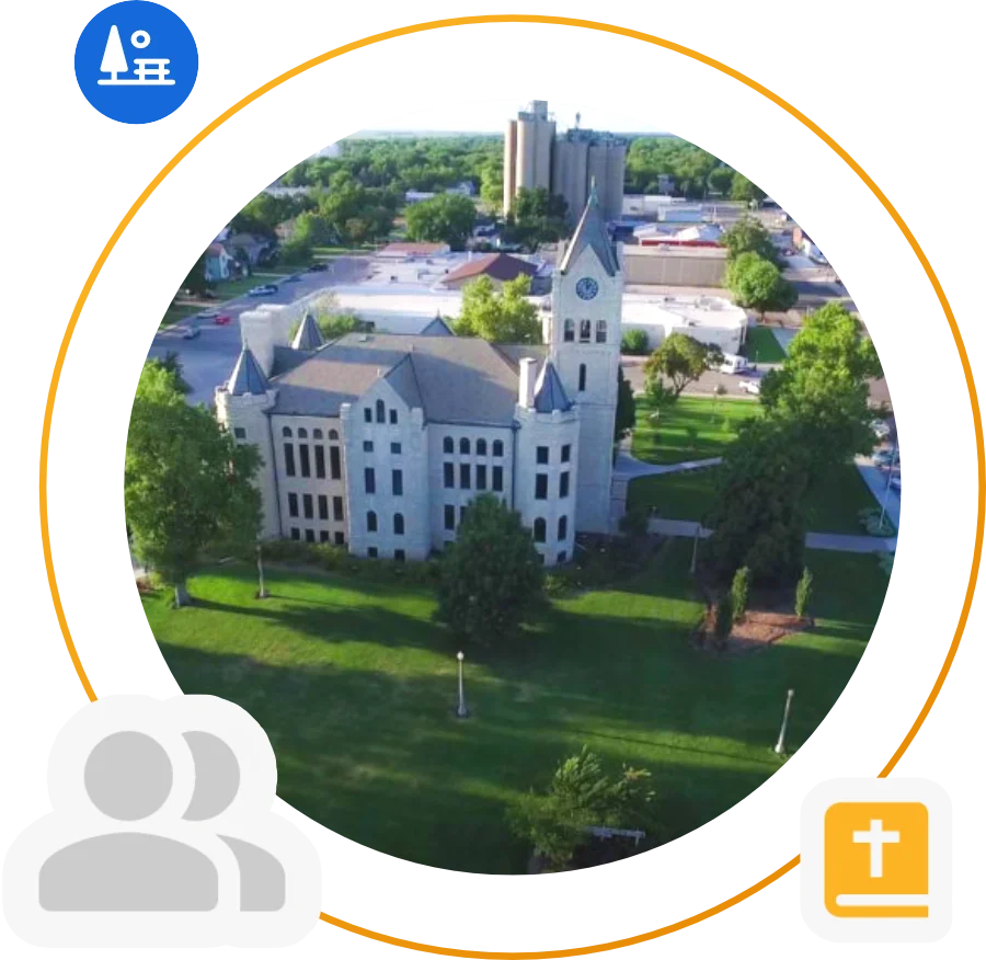 Aerial view of Central Christian College of Kansas campus featuring the historic main building and surrounding green spaces in McPherson, Kansas.