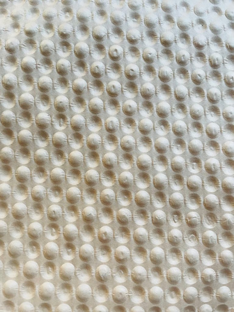 a close up of a textured surface with circles