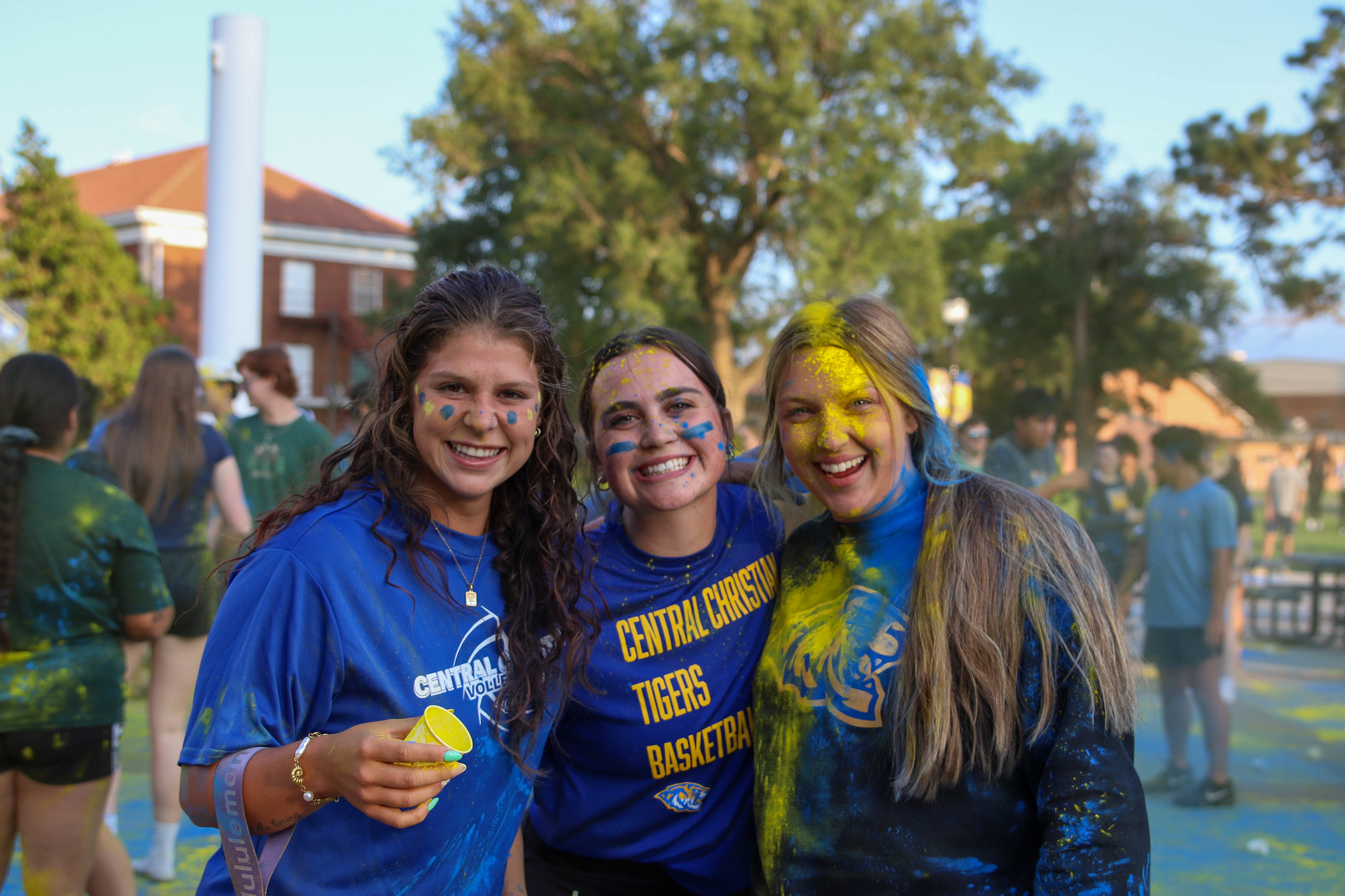 Students with colorful chalk on faces